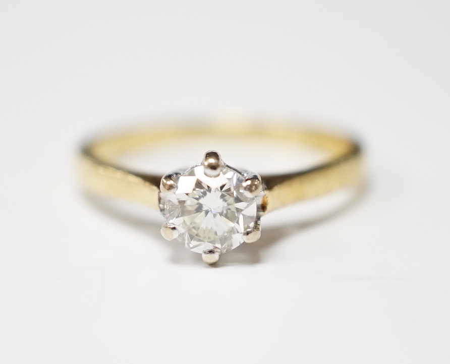 A modern 18ct gold and solitaire set diamond ring, the stone weighing 0.50ct, gross weight 2.2 grams.